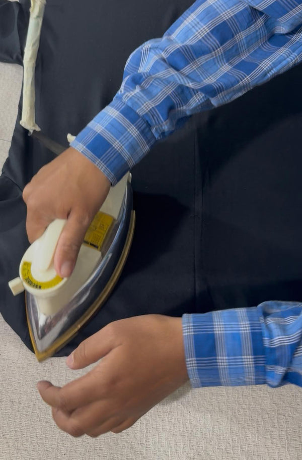 Pressing a garment with an iron